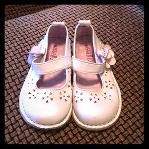 White mary janes with floral cutouts; size 6